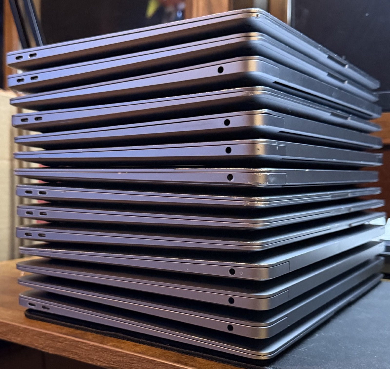 Stack of M1 MacBook Airs showing ports